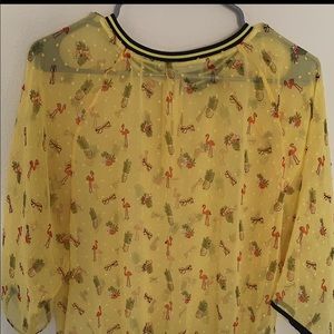 A yellow  shirt from splash size 12 barley used
